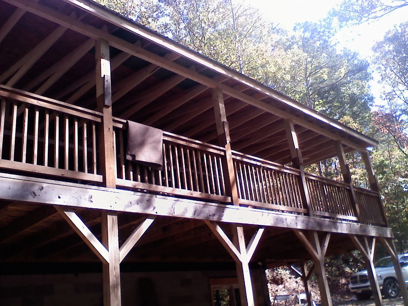 Timber framing under a new elevated porch and deck — Roof Leak Repair in Granby by Roofing Brothers